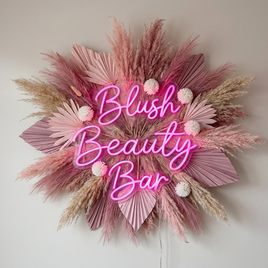 LED-Neon-Logo „Blush Beauty Bar“ über Pampasgras im Beautysalon – Neon Atelier